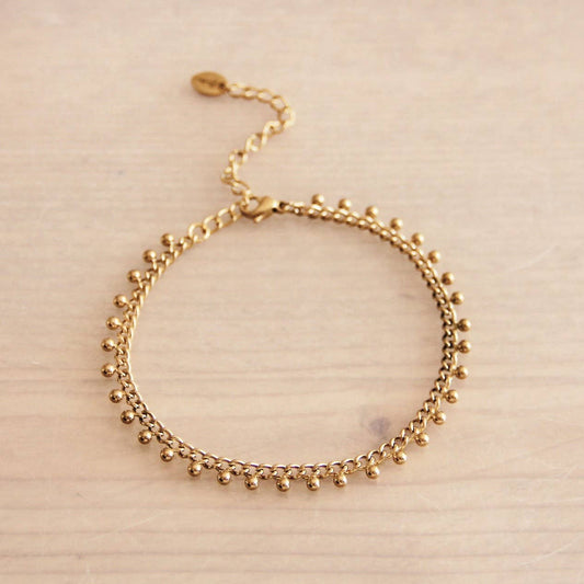 Stalen schakelarmband met balletjes - goud