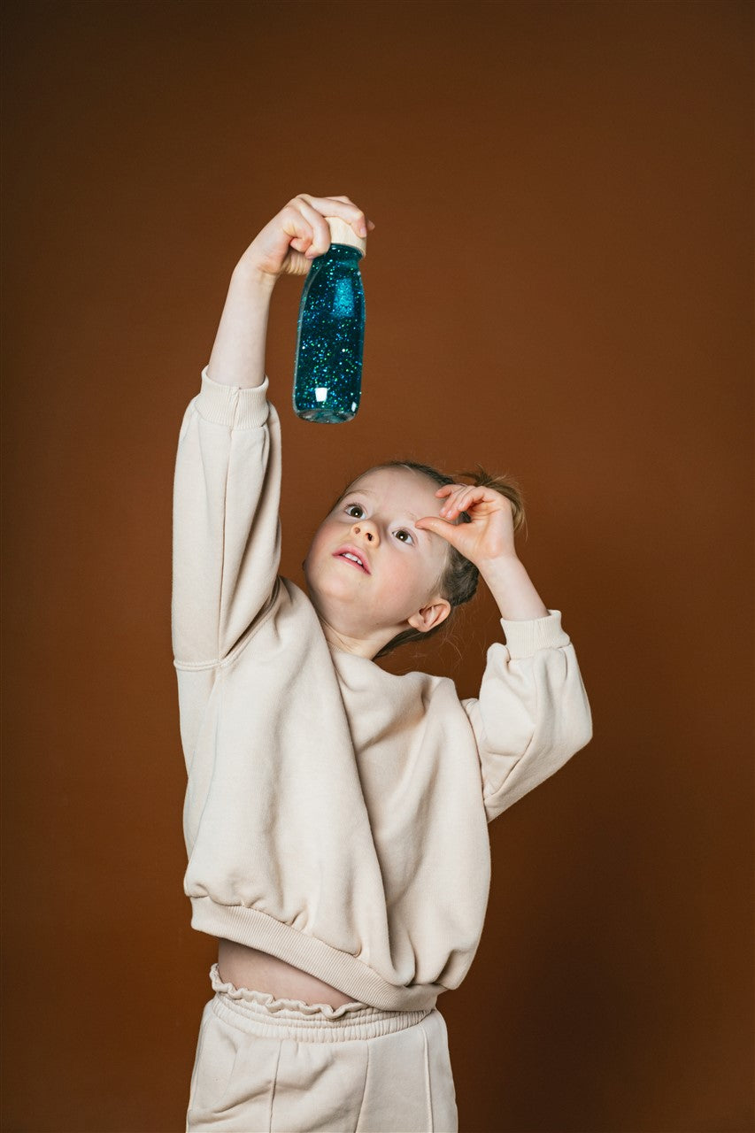Sensorische fles – Turquoise glitters en pompomps